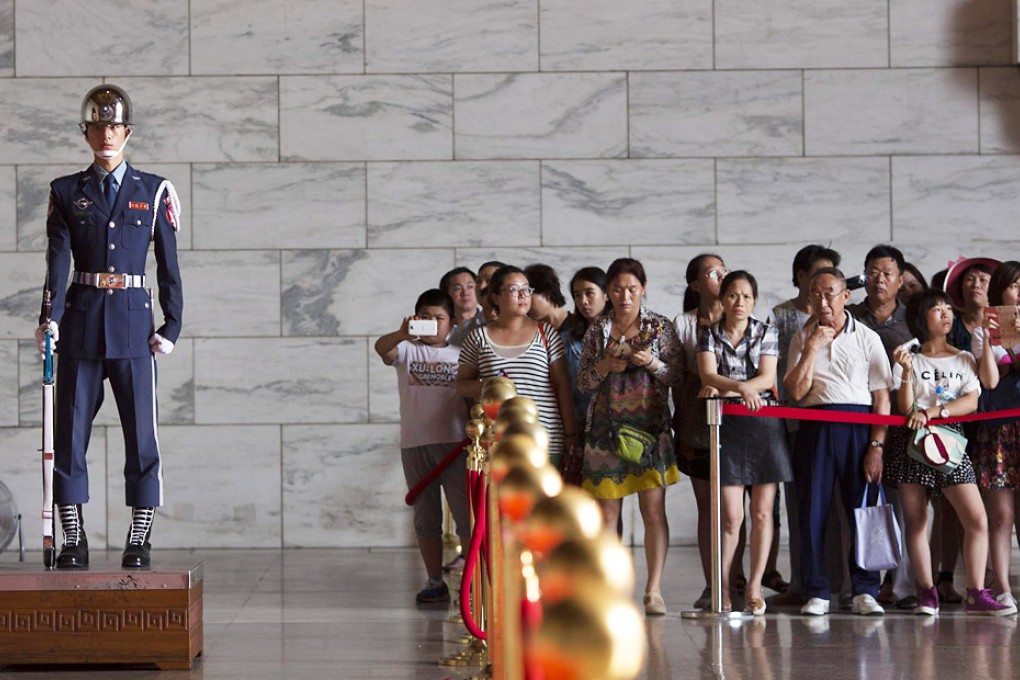 Changing of the guard in the Chiang Kai Shek Memorial Hall in Taipei. Taiwan is becoming a new tourist hot spot for independent mainland travellers. Photo: Bloomberg