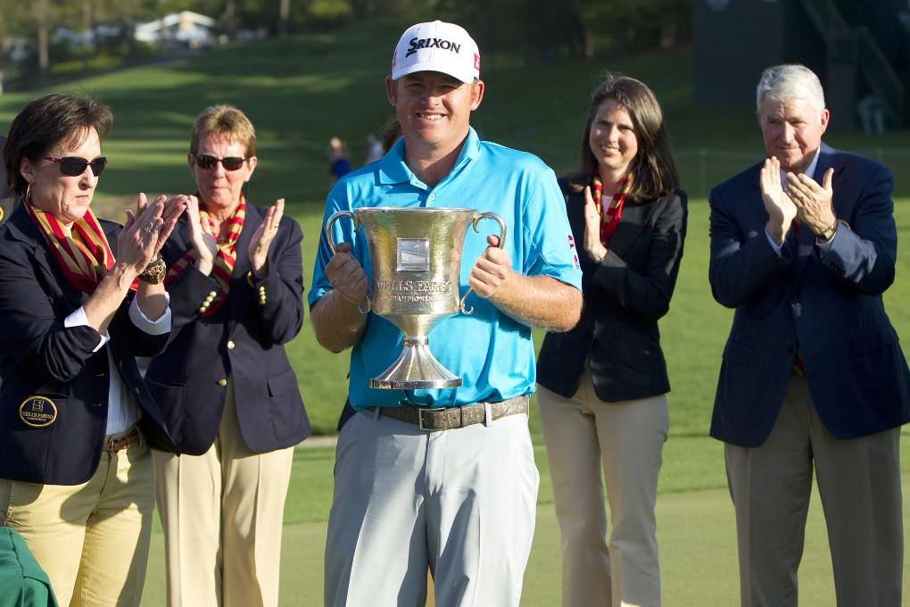 J.B. Holmes shows off his  trophy after winning the Wells Fargo Championship at Quail Hollow Club. Photo: USA Today