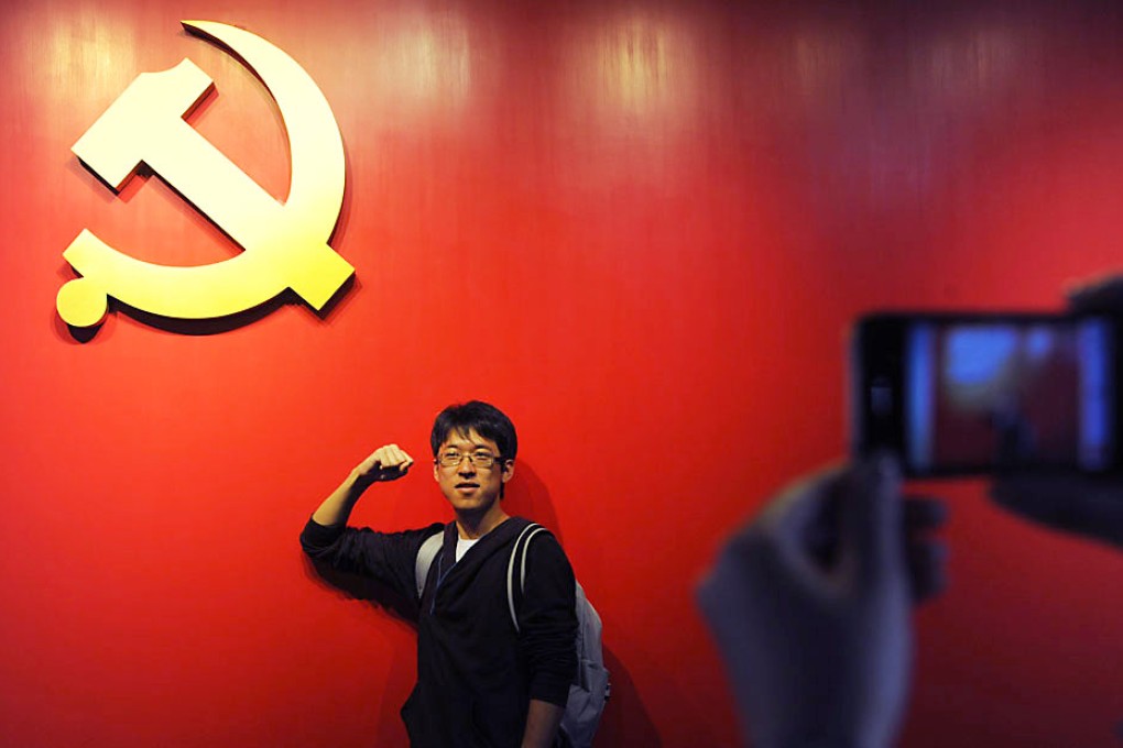 A university student takes his oath to join the Communist Party of China. Photo: Reuters