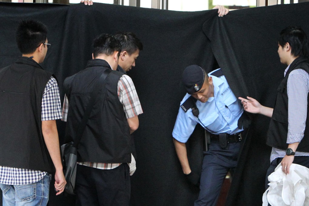 Police cordon off the area where delivery worker Ho Sai-tung was shot by two officers while confronting his estranged wife. Photo: Felix Wong