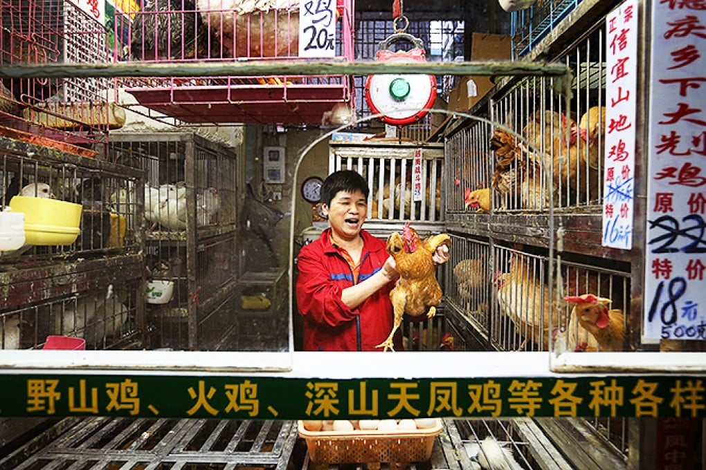 Vendor Li Jinying at her stall in Haizhu district, which is not included in the trial run. Photo: K.Y. Cheng