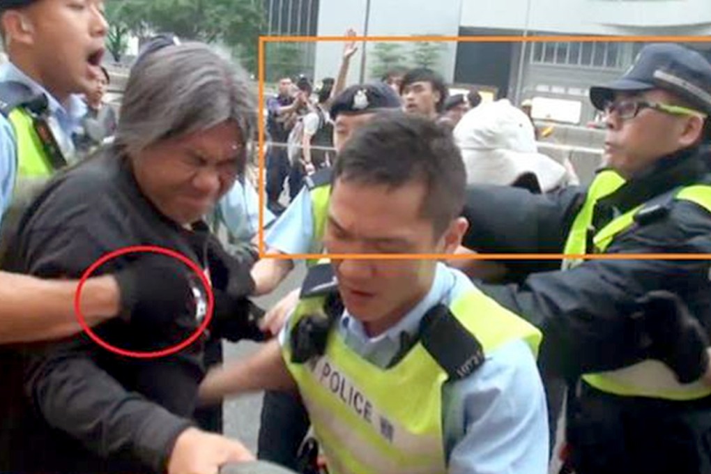 Police fire pepper spray at lawmaker "Long Hair" Leung Kwok-hung during Sunday's march. Photo: SCMP Pictures