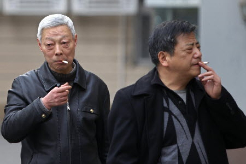Smokers light up in Shanghai. China signed a convention on tobacco control nearly a decade ago, but has yet to honour its commitments. Photo: Reuters