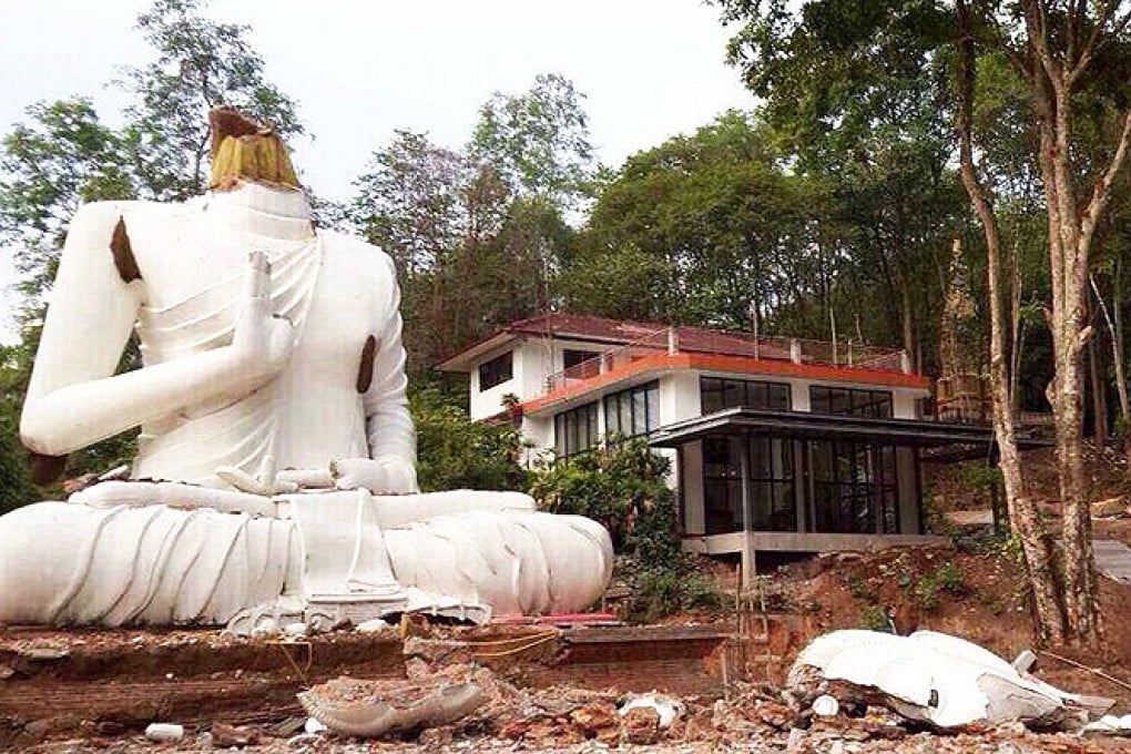 A Buddha statue is seen damaged after an earthquake in Chiang Rai, northern Thailand on Monday. Photo: Xinhua