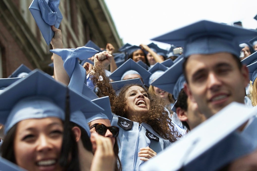 Graduates from Columbia University's School of Journalism cheer during the university's commencement ceremony in New York. Photo: Reuters