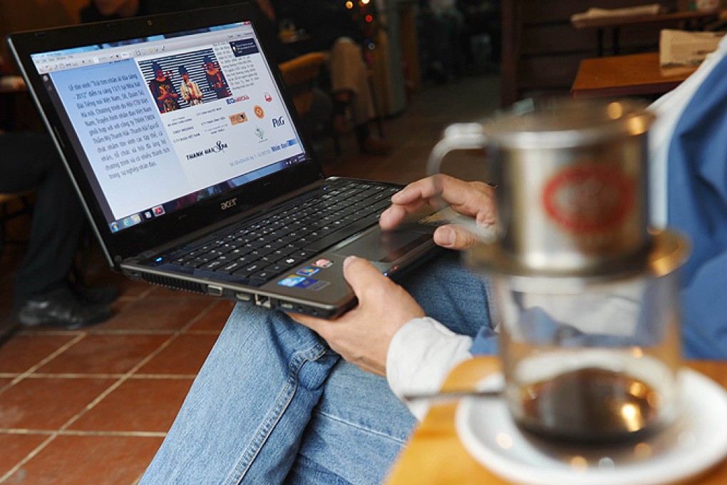 Bloggers Nguyen Huu Vinh and Nguyen Thi Minh Thuy were arrested in Hanoi on Monday, Vietnamese authorities said. Photo: AFP