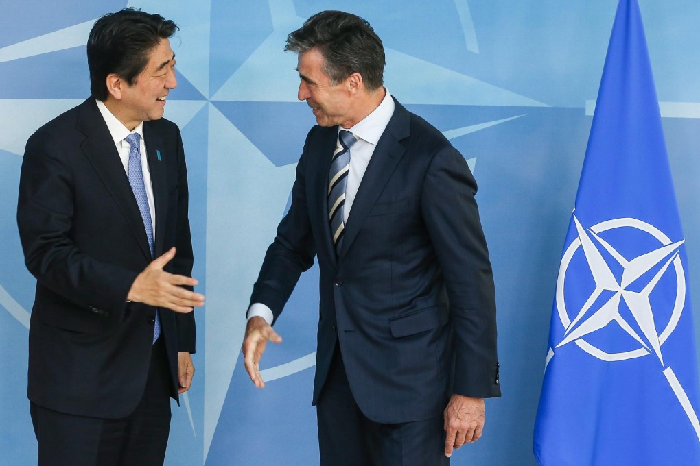 Japanese Prime Minister Shinzo Abe and Nato Secretary General Anders Fogh Rasmussen at Nato headquarters in Brussels. Photo: EPA