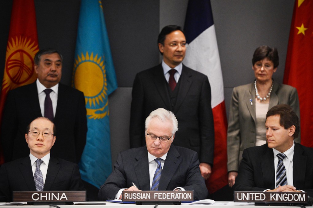 Russia's UN ambassador Vitaly Churkin (centre front) signs a protocol to the Treaty on a Nuclear-Weapon-Free Zone in Central Asia at the UN headquarters in New York. Photo: Xinhua
