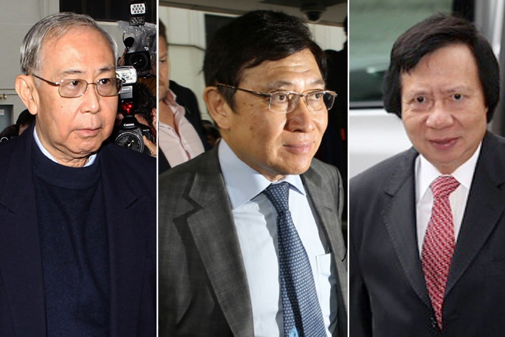 Former chief secretary Rafael Hui Si-yan, left, and billionaire brothers Raymond Kwok Ping-luen, centre, and Thomas Kwok Ping-kwong, arrive at the court at the start of their trial. Photo: SCMP