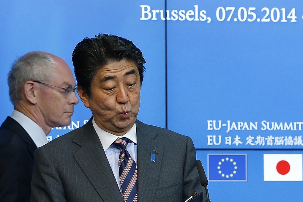Japanese Prime Minister Abe arrives at a joint news conference with European Council President Van Rompuy at the end of a EU-Japan Summit in Brussels. Photo: Reuters