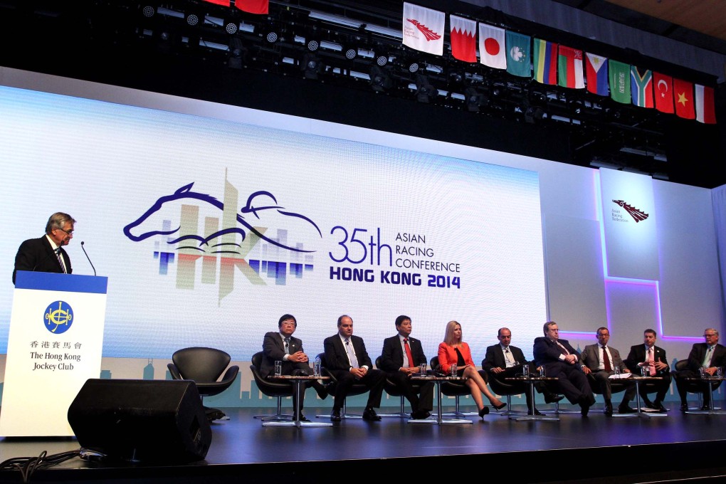 Several top racing executives from different countries are present on stage to discuss their experience and strategies in hosting world-class race events.