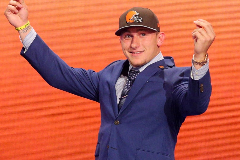 Johnny Manziel gestures after being selected. Photo: USA Today Sports