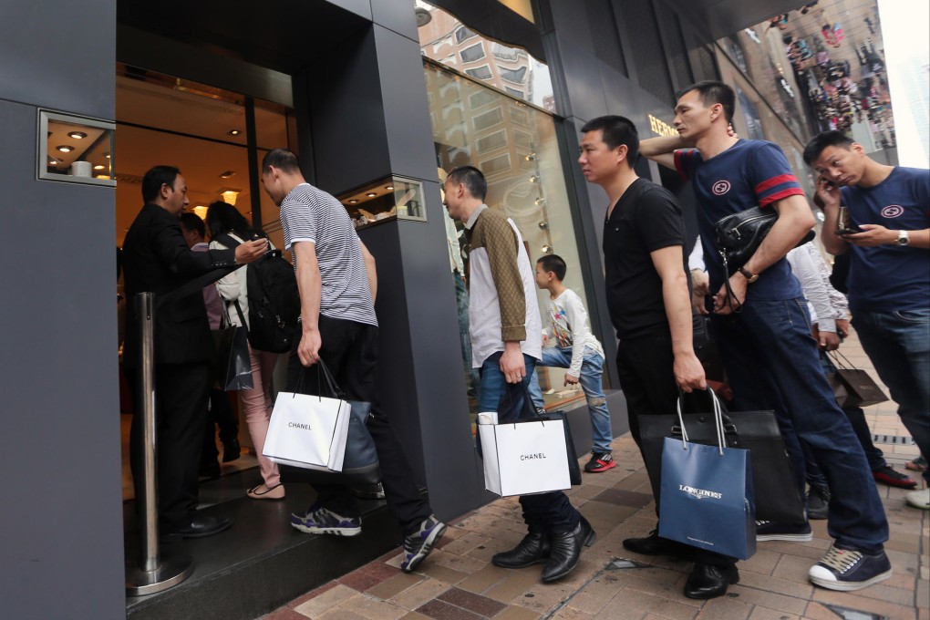 A long line of mainland tourists outside a Hermes store in Tsim Sha Tsui. The luxury retail sector is struggling to recruit and retain enough qualified staff. Photo: Sam Tsang