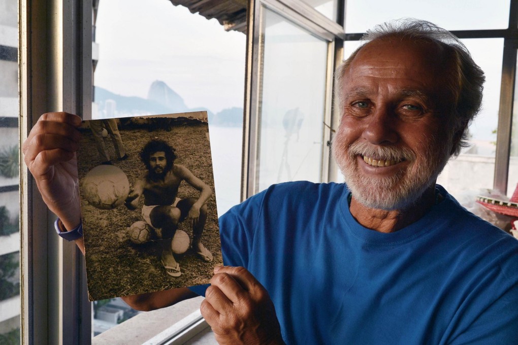 Afonsinho with a picture of himself as a player. Photo: AFP