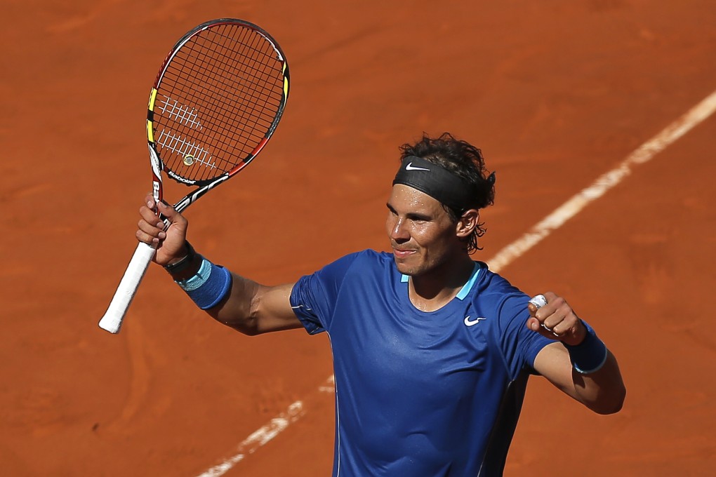 Rafael Nadal celebrates his quarter-final victory over Tomas Berdych at the Madrid Open. Photo: AP