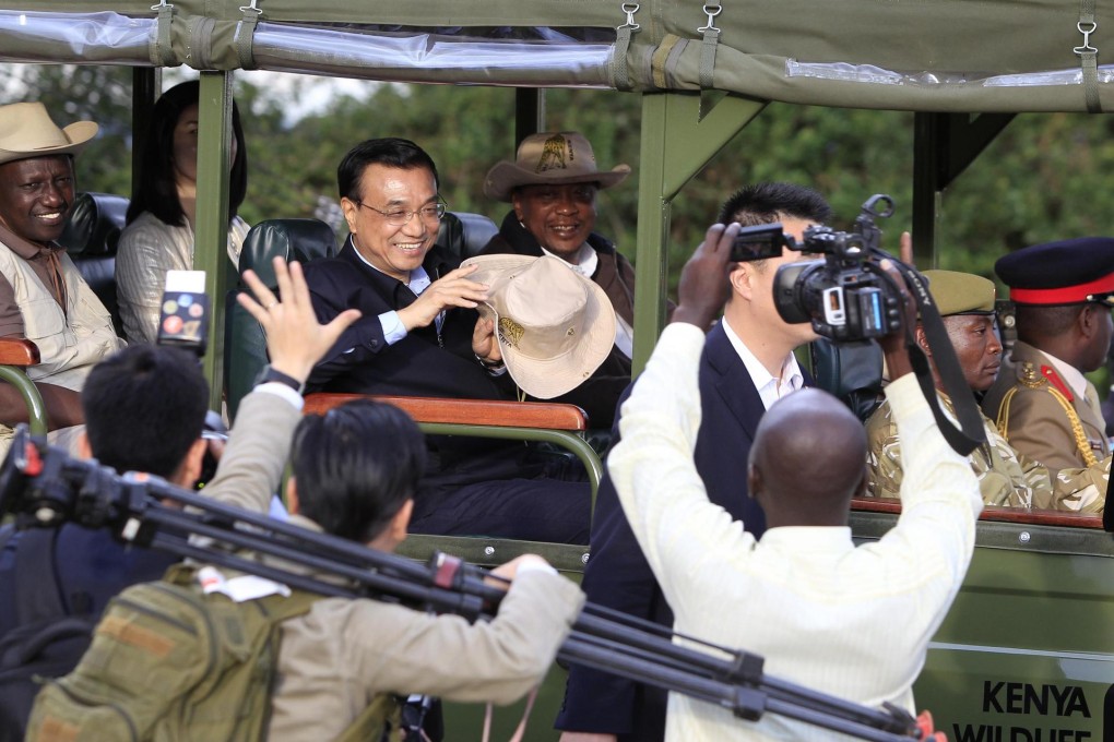 Premier Li Keqiang on a safari drive with Kenyan President Uhuru Kenyatta. Photo: Reuters