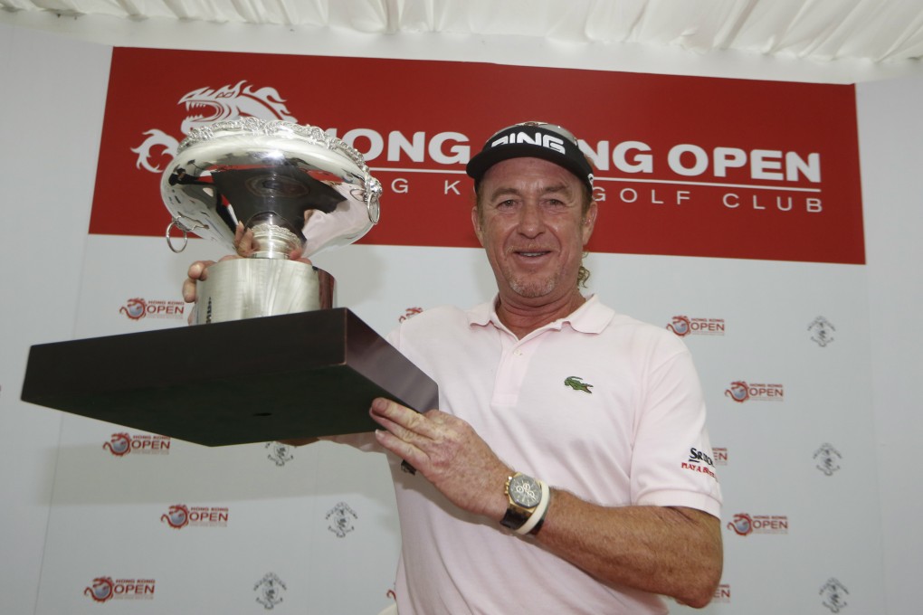 Spaniard Miguel Angel Jimenez with the Hong Kong Open trophy in December 2013. Photo: AP