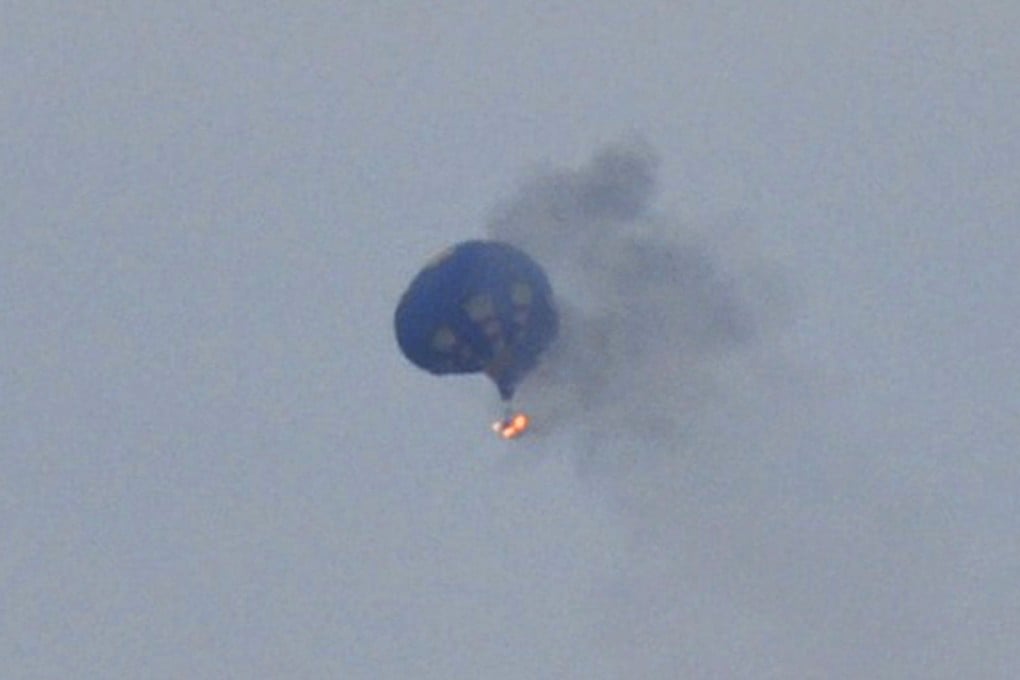 The hot air balloon on fire is pictured north of Richmond, Virginia. Photo: Reuters