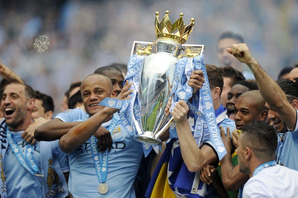 Manchester City captain Vincent Kompany lifts the English Premier League trophy. Photo: EPA