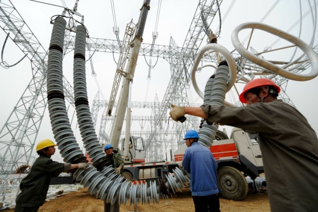 Technician install insulators at a mainland power station. One of the government's plans would see up to 30 per cent of the city's energy come from the mainland grid. Photo: Xinhua