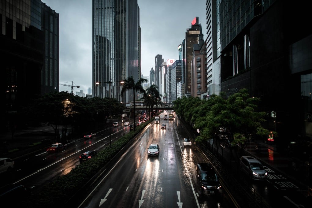 Cars using headlights in the daytime during a storm in Hong Kong. The El Nino weather pattern could emerge this summer would last at least until autumn, according to Japan's weather bureau. Photo: AFP