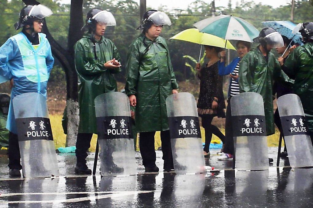 Riot police were still on streets the next day. Photo: Reuters
