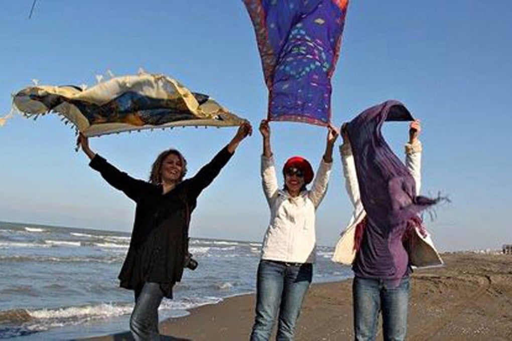 Three Iranian women pose without their hijabs. Photo: Facebook