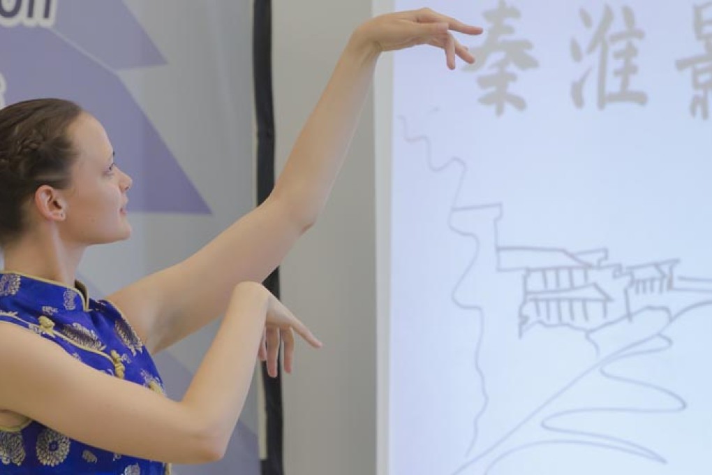 A student studying under the Confucius Institute in Hungary dances and sings a Chinese song. There are 440 Confucius Institutes in 120 countries and regions worldwide. Photo: Xinhua