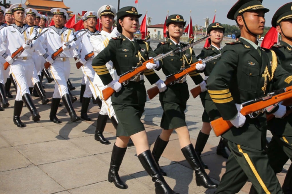 The women, the ones pictured here from the army contingent, marched with more than 100 male comrades at the ceremony. Photo: Xinhua