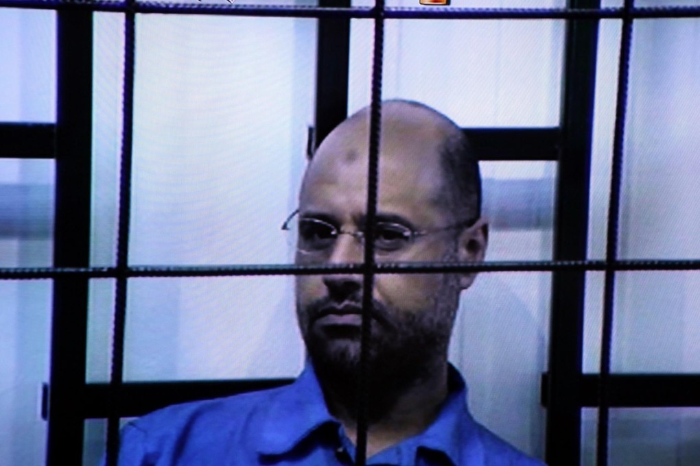 Saif al-Islam Gaddafi at his trial in Tripoli. Photo: EPA