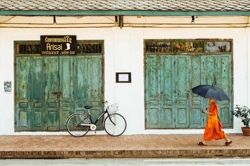 Novice monk on an afternoon stroll.