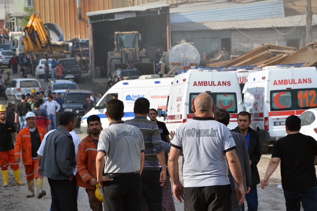 Rescue workers and ambulances at the entrance of a coal mine in Soma, western Turkey, after an explosion took place. Photo: AP