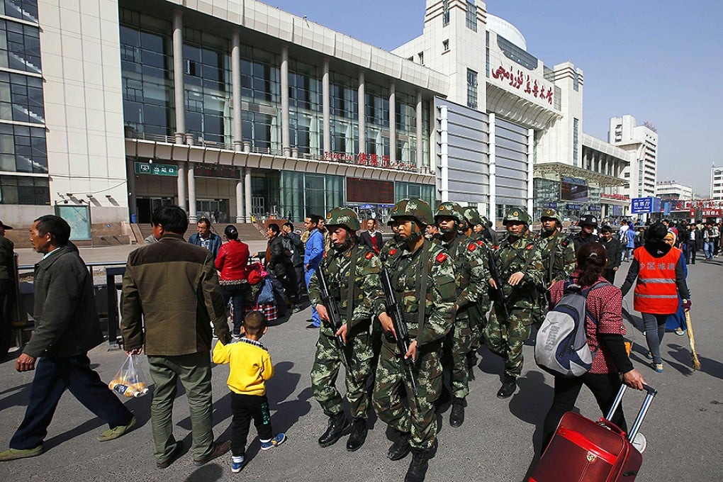 Paramilitary troops on patrol after the attack at the main railway station in Urumqi, capital of Xinjiang, last month. Photo: Reuters