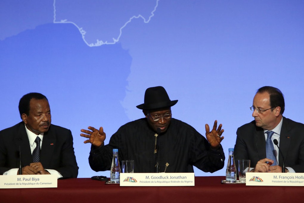 Nigeria President Goodluck Jonathan (centre) at a press conference with Cameroon President Paul Biya (left) and French President Francois Hollande in Paris.