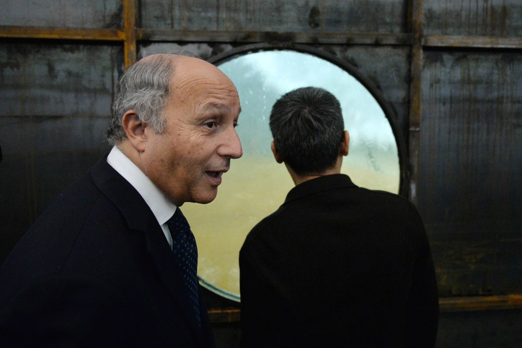 French Foreign Minister Laurent Fabius, who is on a four-day visit to China, was questioned on reports Chinese police would patrol in Paris over the summer. Photo: AFP