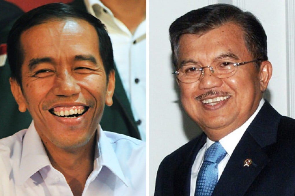 Joko Widodo (left) has boosted his presidential campaign by choosing veteran politician Jusaf Kalla (right) as his running mate. Photo: AFP