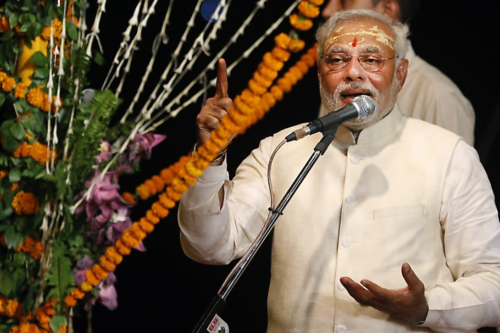 India's next prime minister Narendra Modi speaks after performing evening rituals on the banks of the River Ganges in Varanasi. Photo: AP