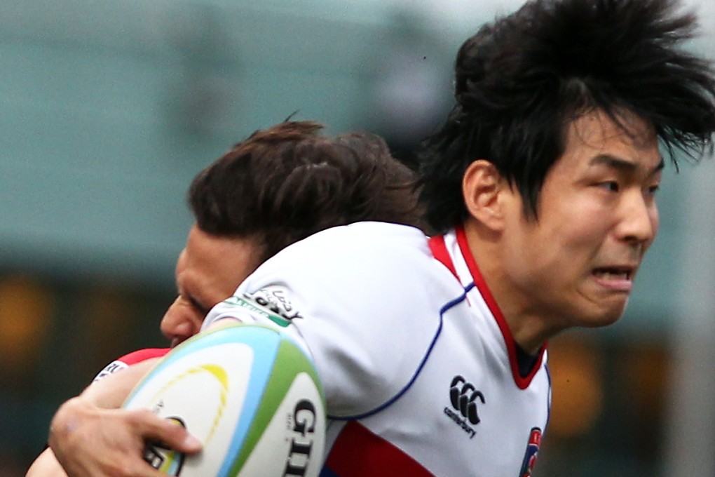South Korea lock Youn Kwon-woo is tackled by Hong Kong wing Rowan Varty during their ARFU Asian Five Nations clash at Hong Kong Football Club on May 10. Photo: Jonathan Wong/SCMP