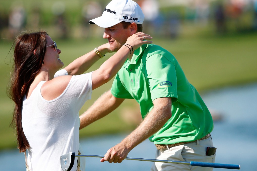 Brendon Todd is congratulated by his wife Rachel following the final round. Photo: AFP