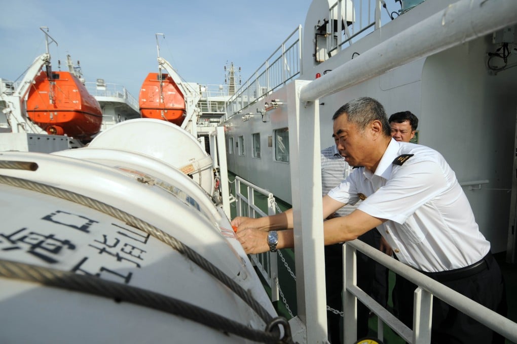 Ship personnel check the life rafts aboard passenger ship Wuzhishan, deployed to pick up Chinese in Vietnam. Photo: Xinhua