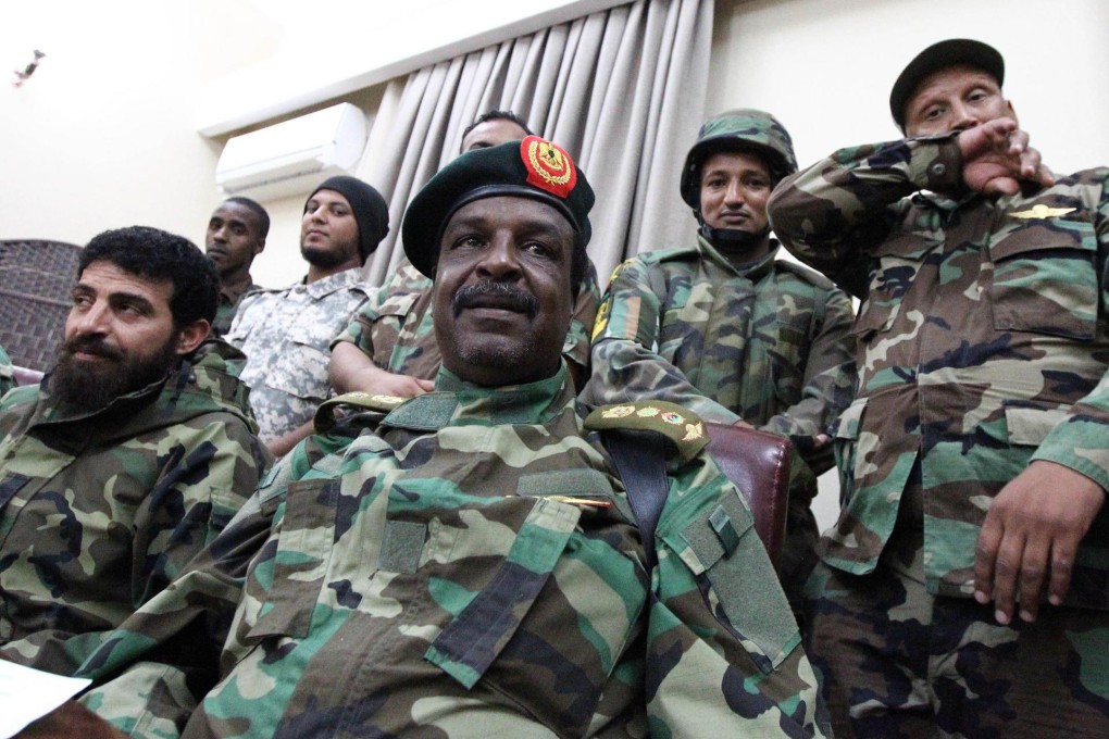 Colonel Wanis Abu Khamada (centre) said his troops were joining the fight against Islamists. Photo: AFP