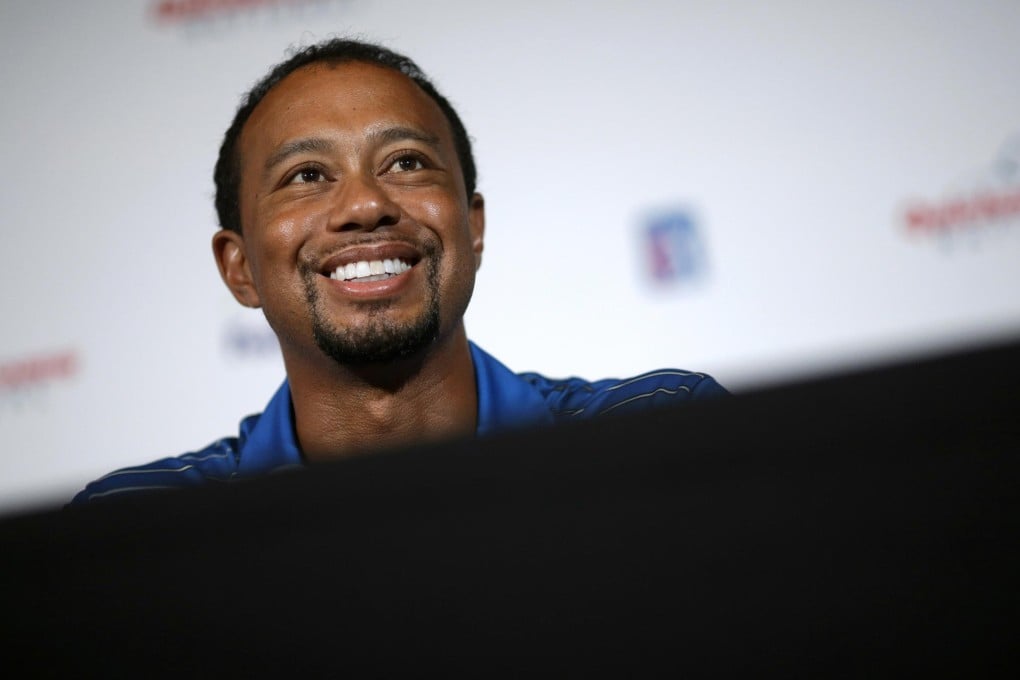 Tiger Woods still cannot take a full swing with a club. Photo: AP