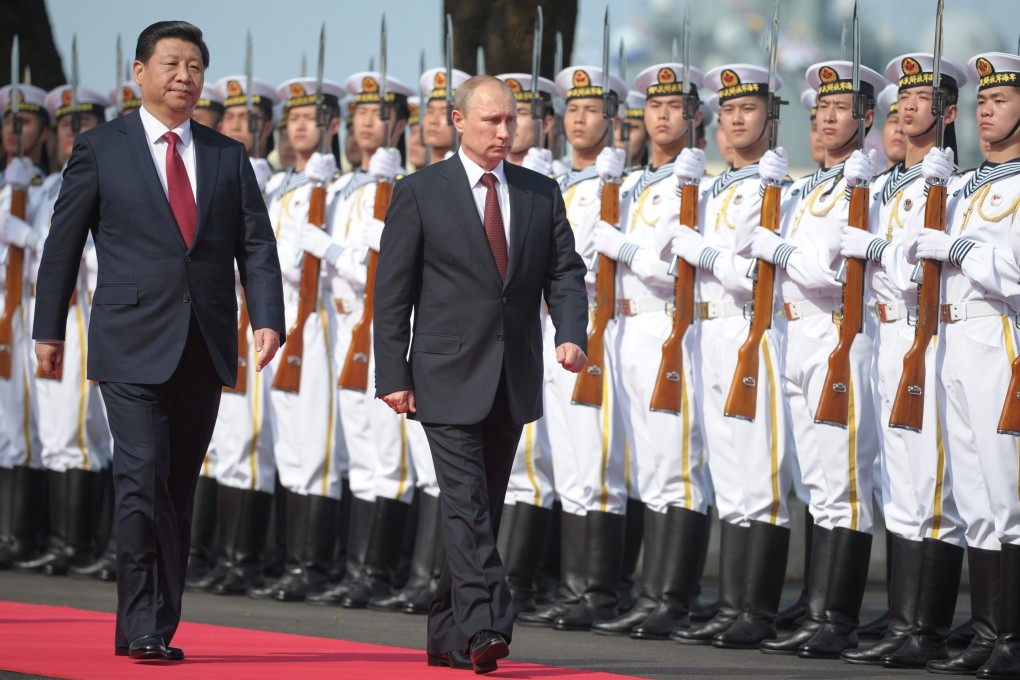 Chinese President Xi Jinping (left) and Russian President Vladimir Putin said in a joint statement that the two countries would seek to defend the "information space" together. Photo: EPA