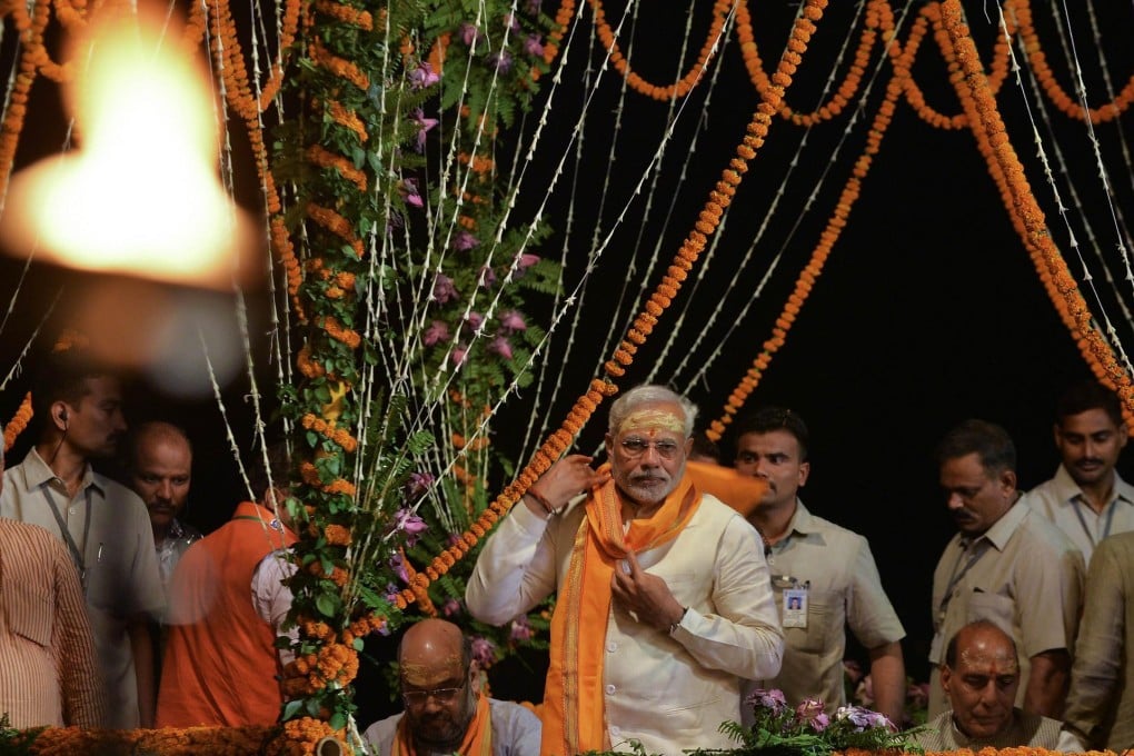 As chief minister of the western Indian state of Gujarat, Narendra Modi (centre) reformed the power sector. Photo: AFP