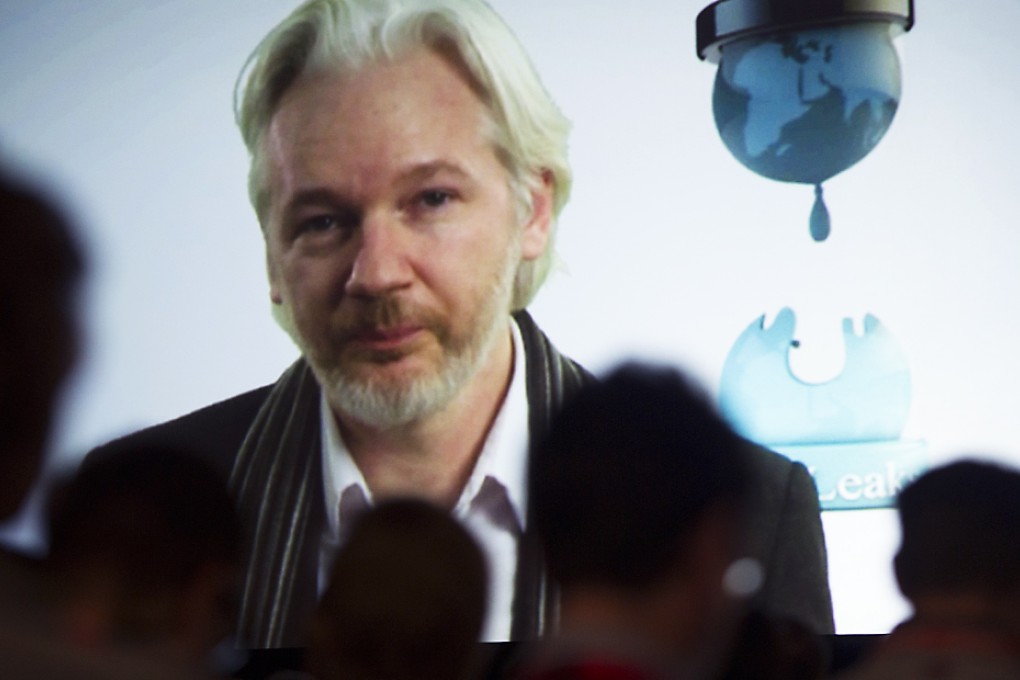 WikiLeaks founder Julian Assange appeared by video link from the Ecuadoran embassy, as he did above for a festival in the US. Photo: Bloomberg
