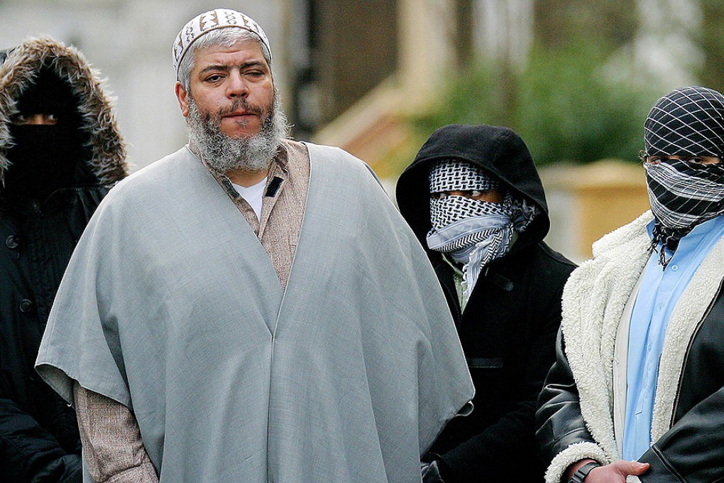 File picture of muslim cleric Abu Hamza surrounded by supporters outside the North London Mosque at Finsbury Park in 2003. Photo: Reuters