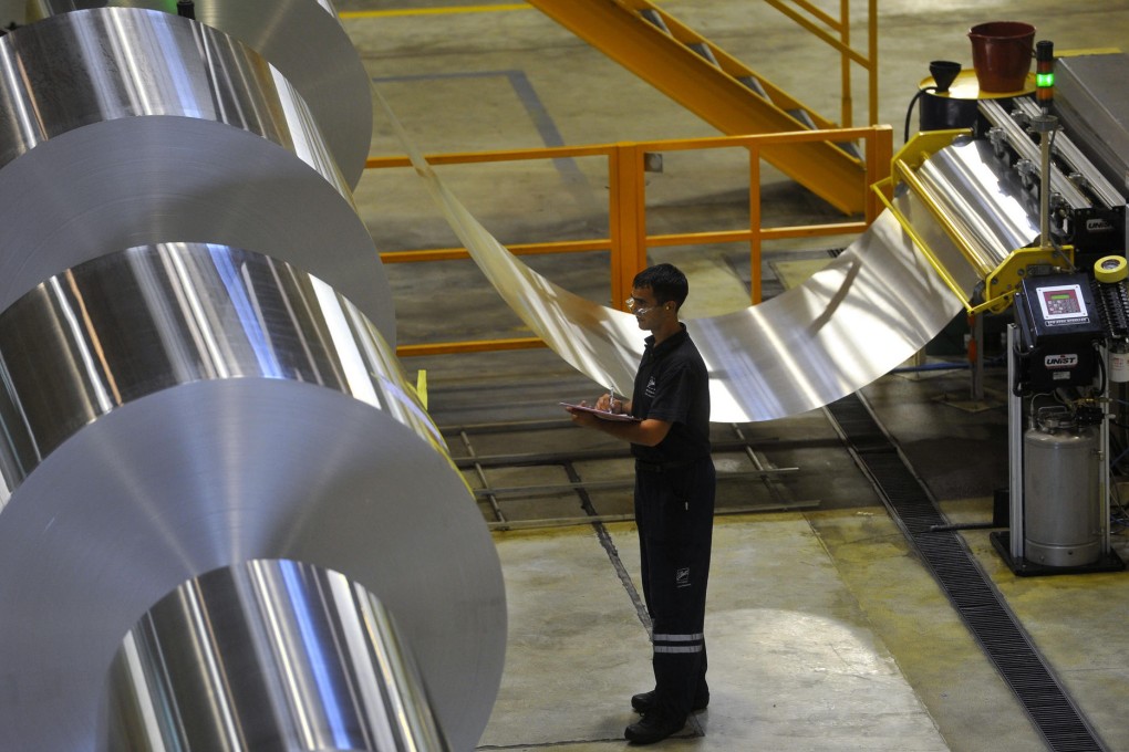Aluminium rolls are ready for beverage-can production. The metal has fallen 1.6 per cent since the start of the year. Photo: Bloomberg