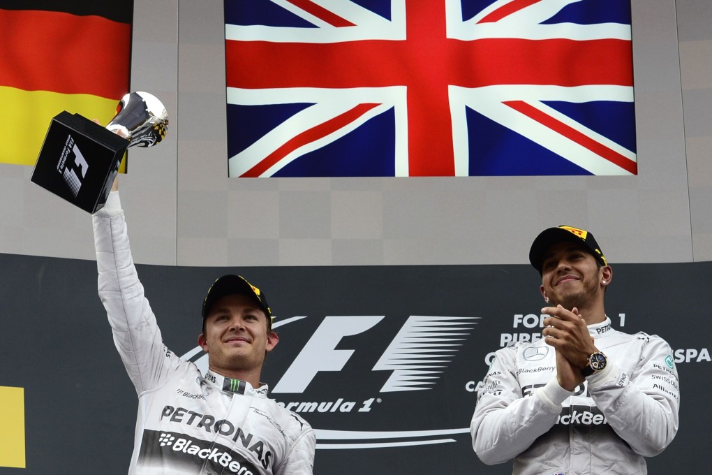 Nico Rosberg (left) and Lewis Hamilton of the Mercedes team celebrate on the podium after the Spanish Formula One Grand Prix last week. Photo: AFP
