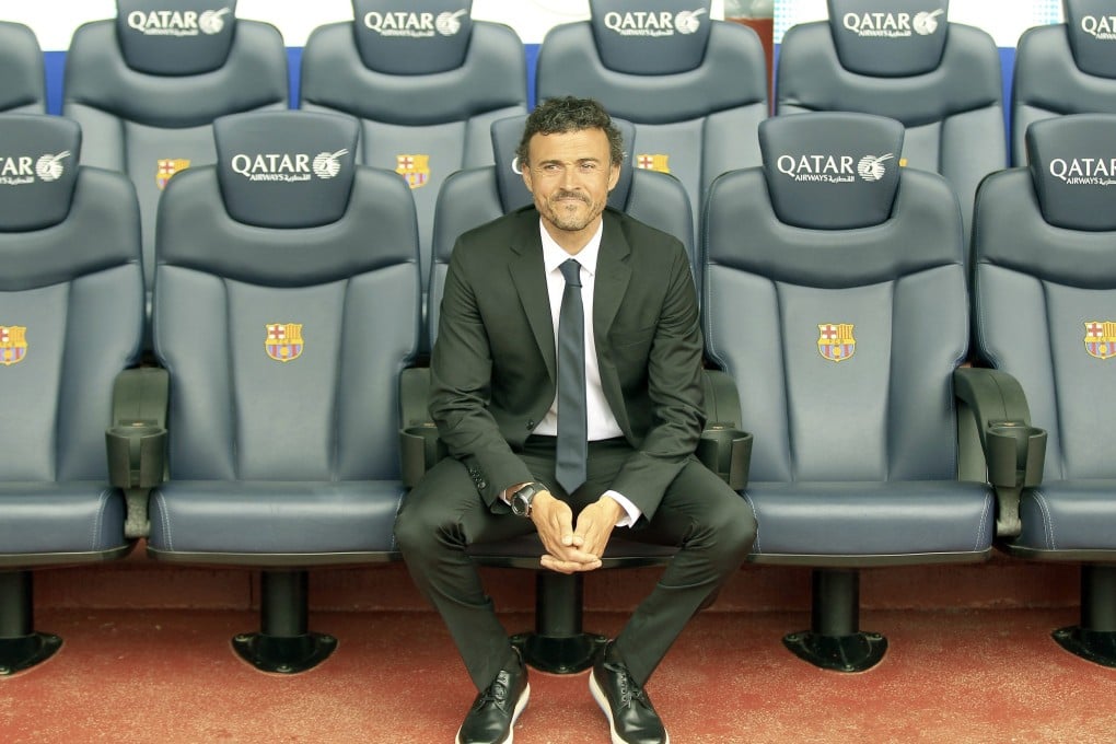 Luis Enrique takes in the view from the dugout as he is unveiled to the press as Barcelona's new manager. Photo: EPA