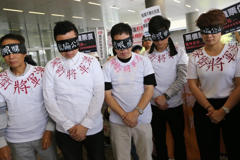 Tseung Kwan O residents demonstrate outside the Legco building, urging legislators to stop the landfill extension plan. Photo: David Wong